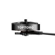 A close-up of a black TOPTORQ brushless drone motor with a white brand logo on the side, mounted on a black shaft against a solid white background.