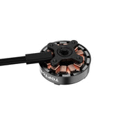 A black circular brushless motor with copper windings and a black cable, shown on a plain white background. The brand name 'TOPTOR' is printed in white on the side.