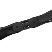 Close-up of a black carbon fiber shaft with a central black metal mounting plate and visible white brand lettering on a white background.
